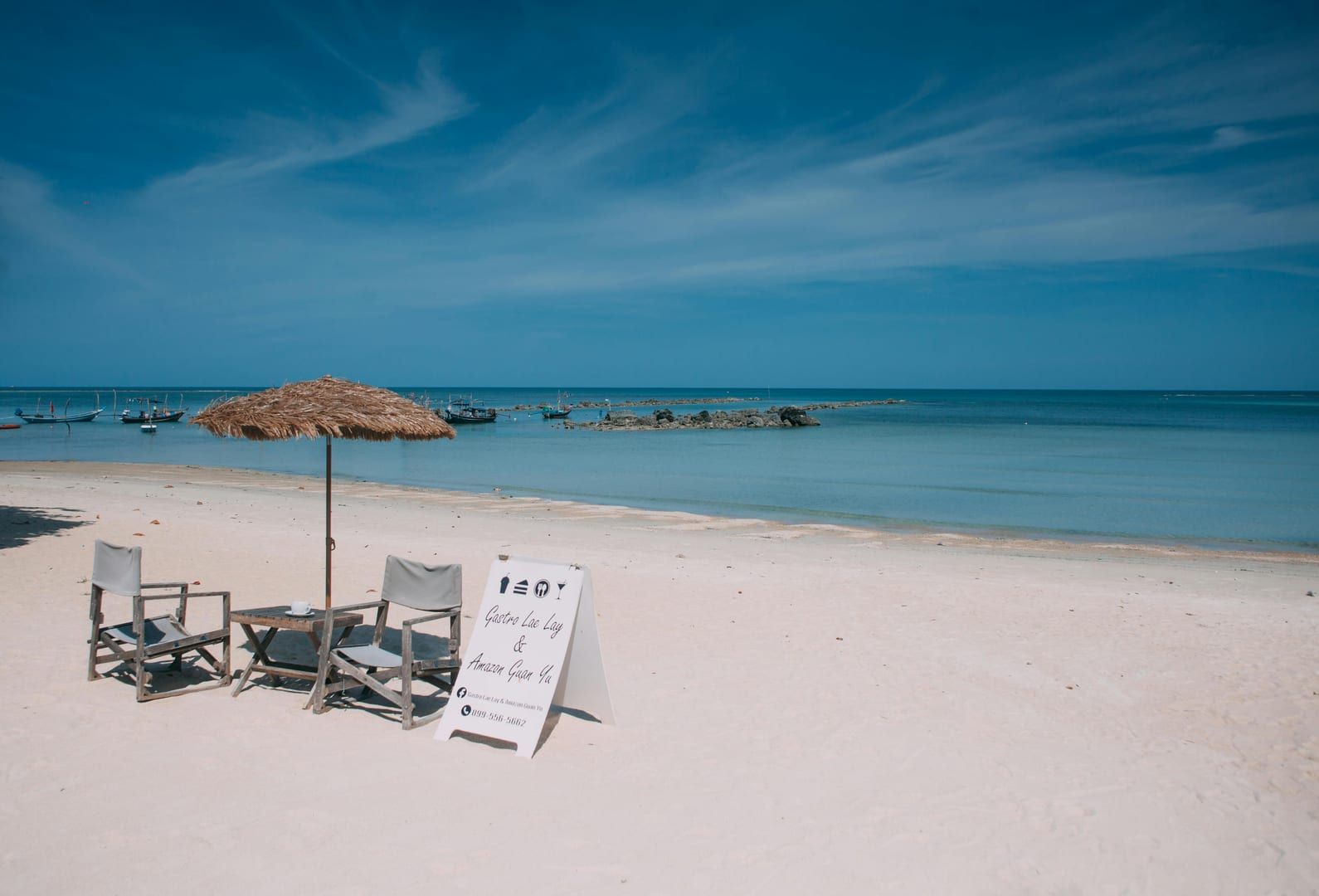 Beach chairs and parasol at Choeng Mon Beach Koh Samui luxury resort area