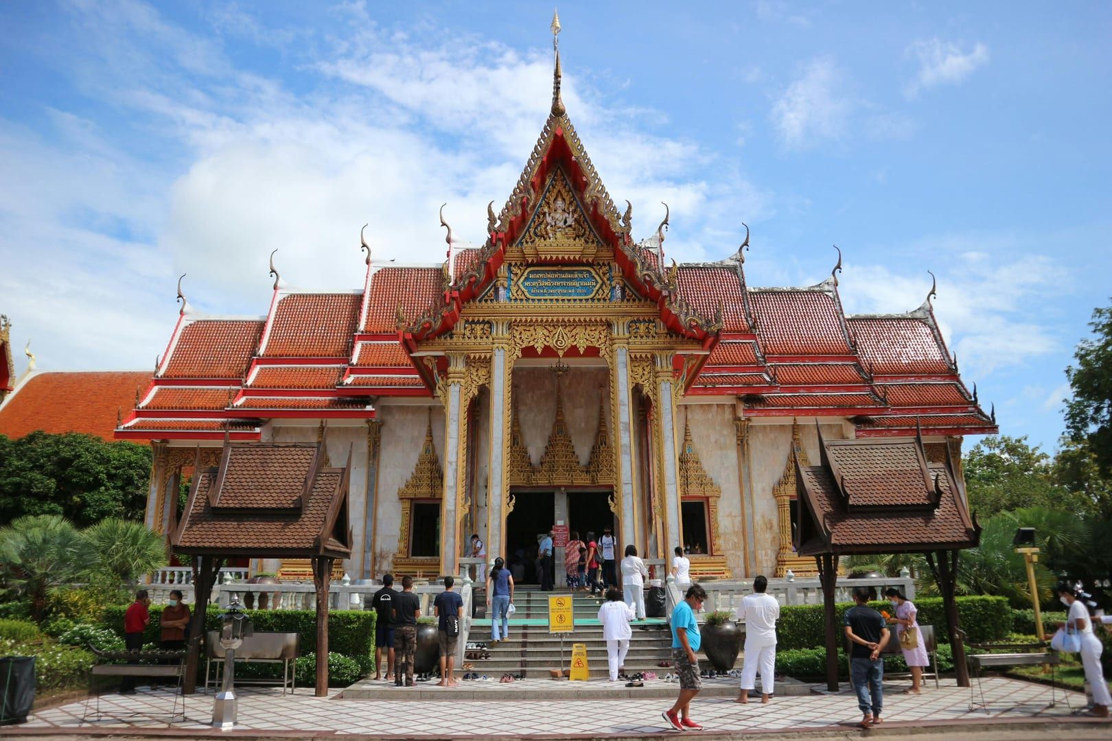 Traditional Thai wood carvings at the temple entrance