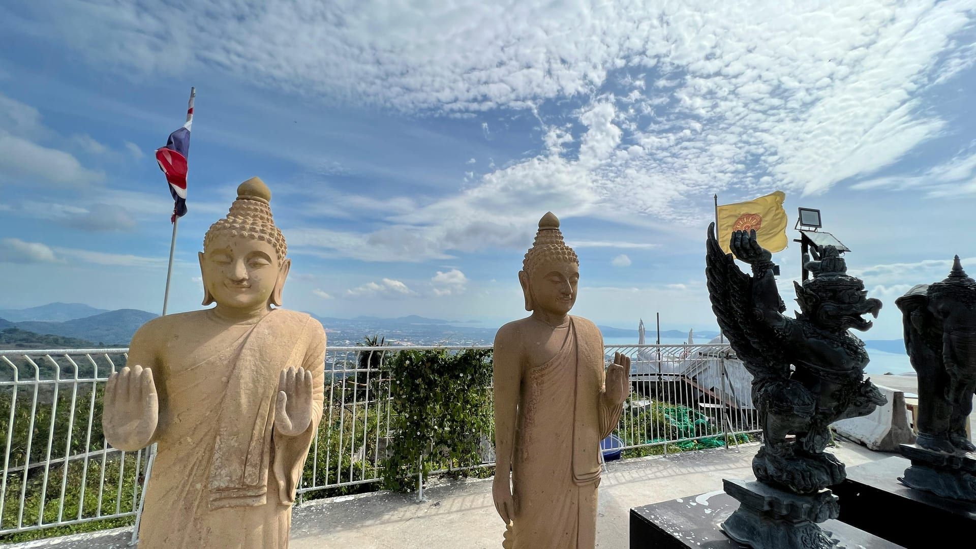 Buddha statues and temple structures under clear sky at Wat Phra Yai Koh Samui