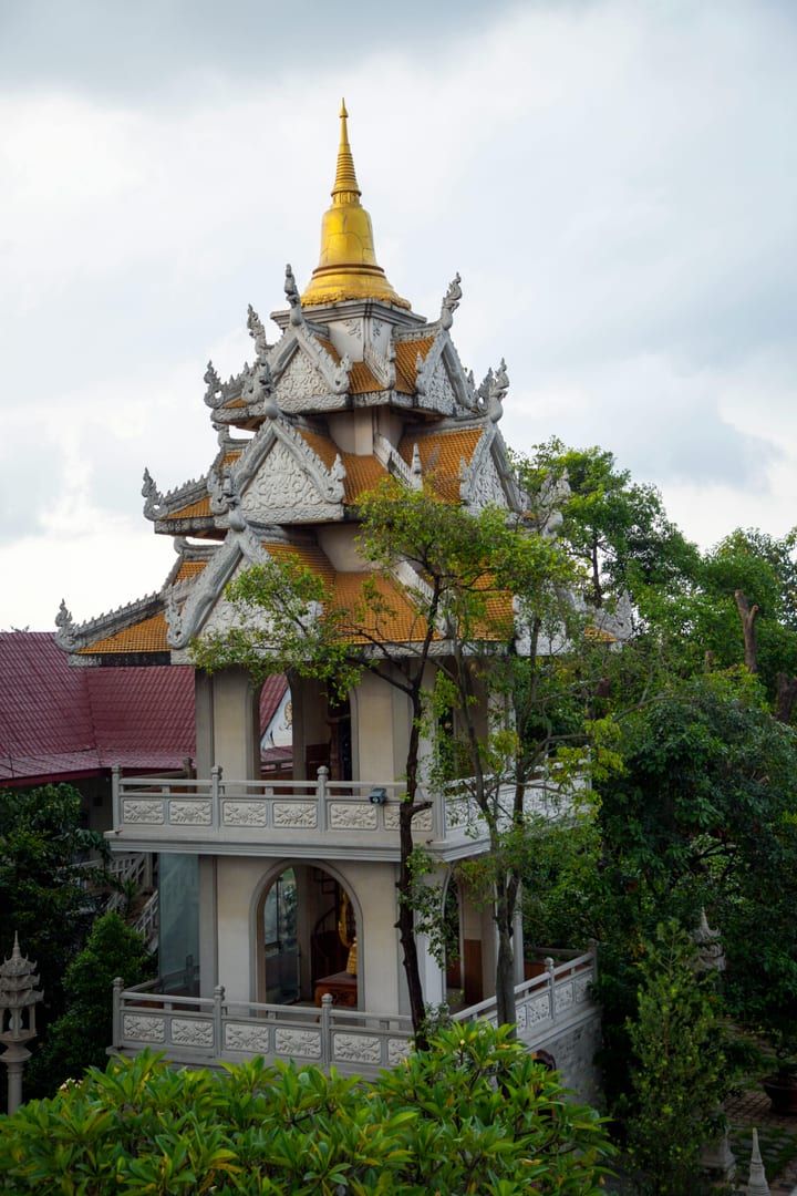 Shaded temple grounds and tropical foliage