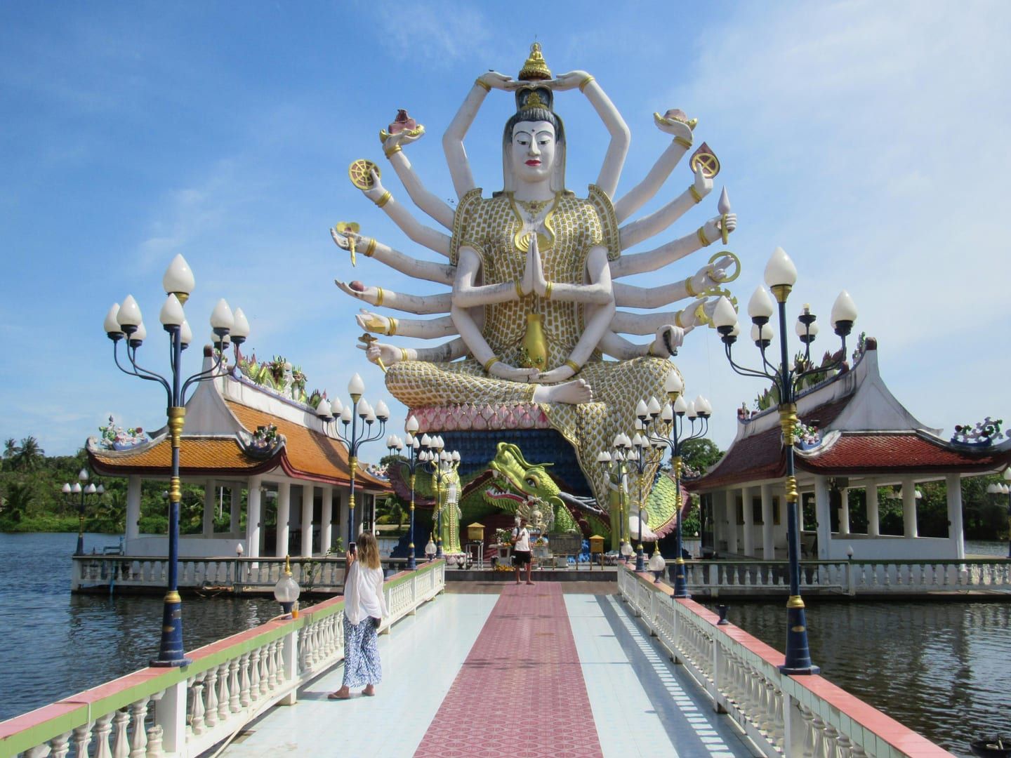 Multi-armed Guanyin statue at Chinese Thai temple Koh Samui lake