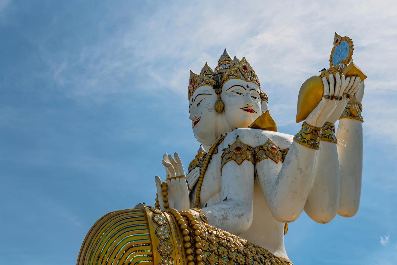 Intricate Brahma figure at Koh Samui fish feeding temple complex