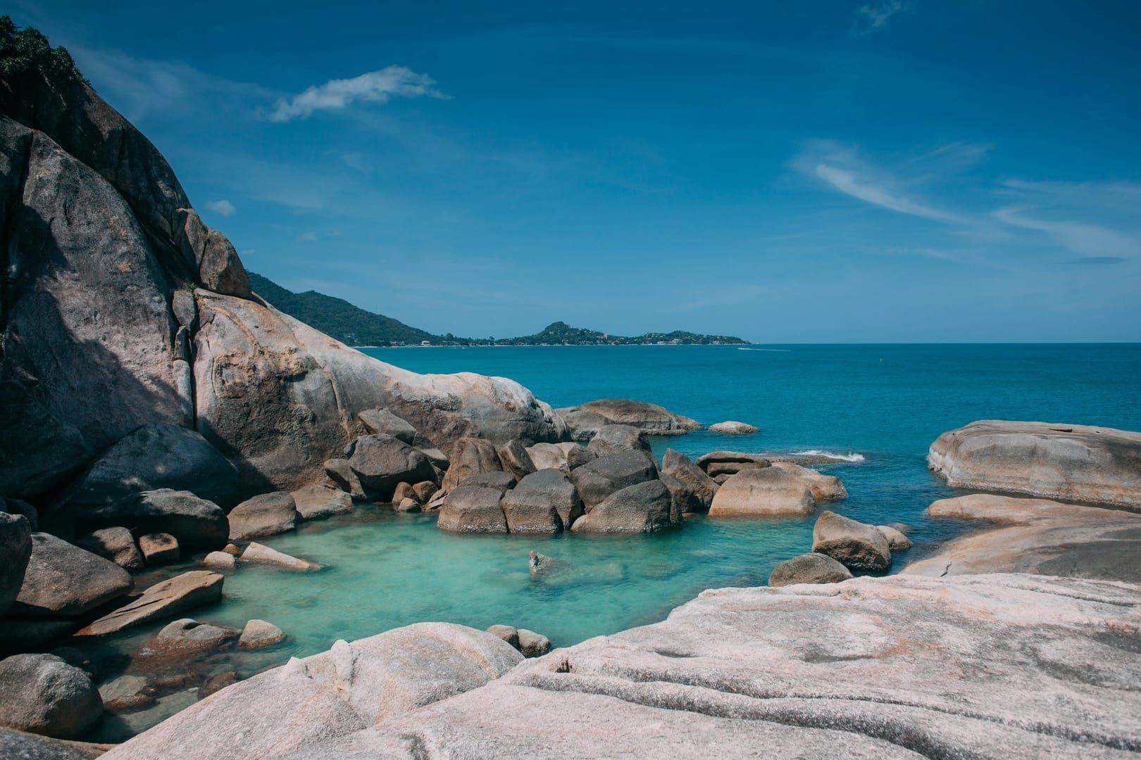 Rocky lagoon with turquoise water near Na Muang jungle trail Samui